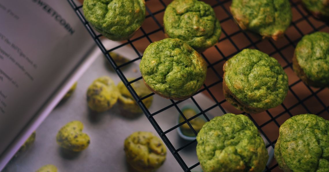 Green superfood muffins on a cooling rack