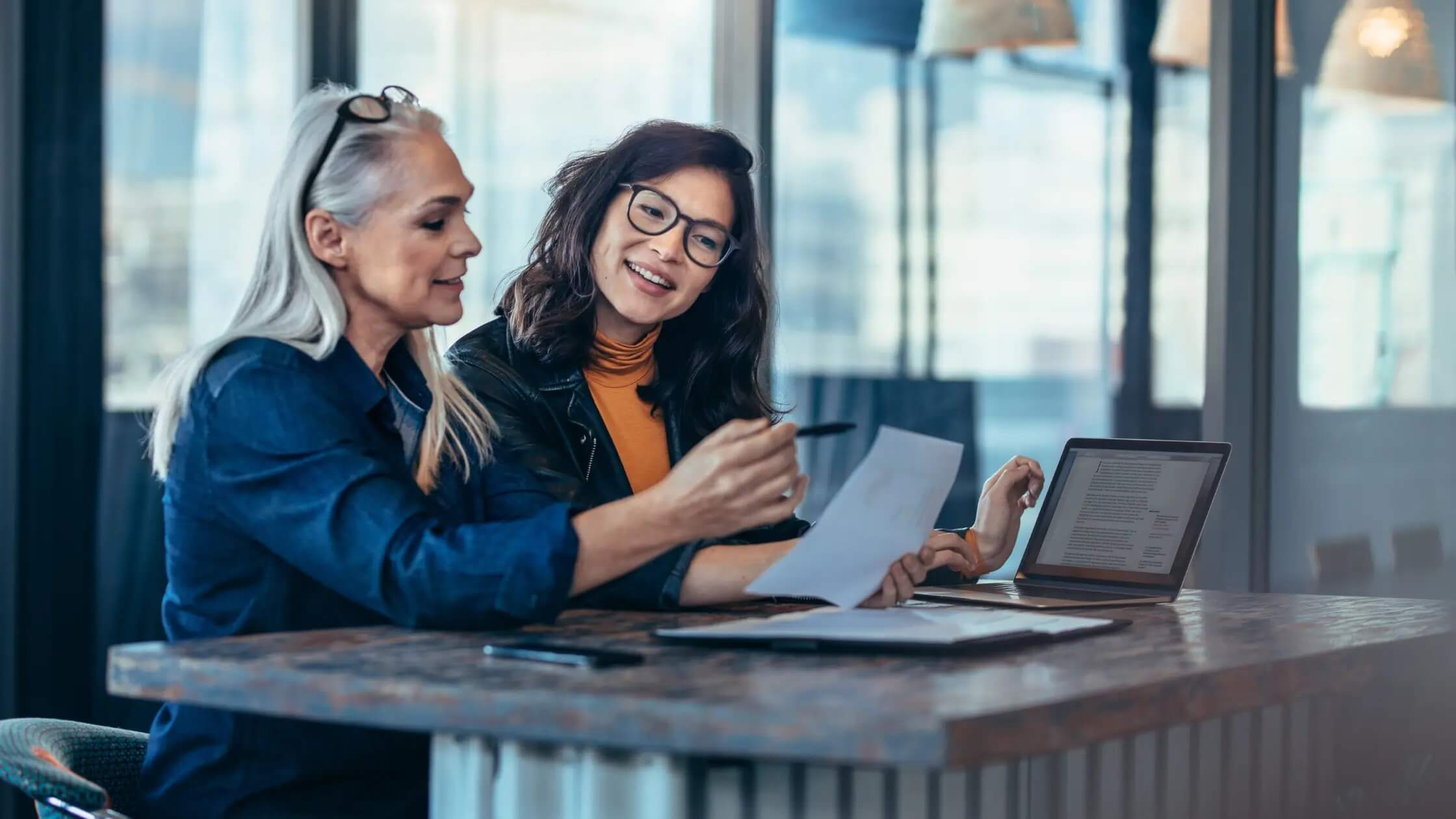 two women focused on work