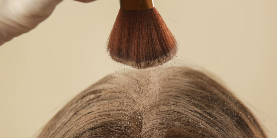 Dry shampoo powder application with brush