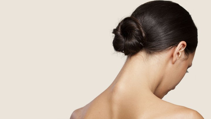 woman with a slicked-back bun